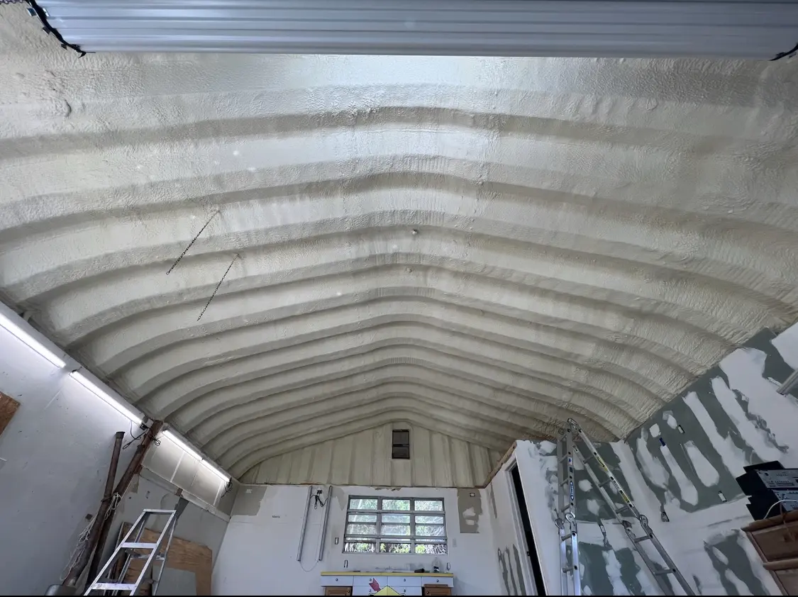 Spray polyurethane foam applied to the underside of a metal roof deck in Upper Darby